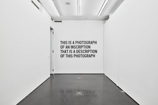 This Is a Photograph of an Inscription That Is a Description of This Photograph (2016) Medium: Photographic print on archival paper mounted on dibond Framed Dimensions: 74.5 × 111.2 cm.